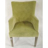 A contemporary lime green upholstered button back armchair, 96cm high x 62cm wide x 66cm deep