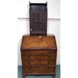 A 20th century mahogany veneered writing bureau, 97cm high x 77cm wide x 47cm deep and an oak