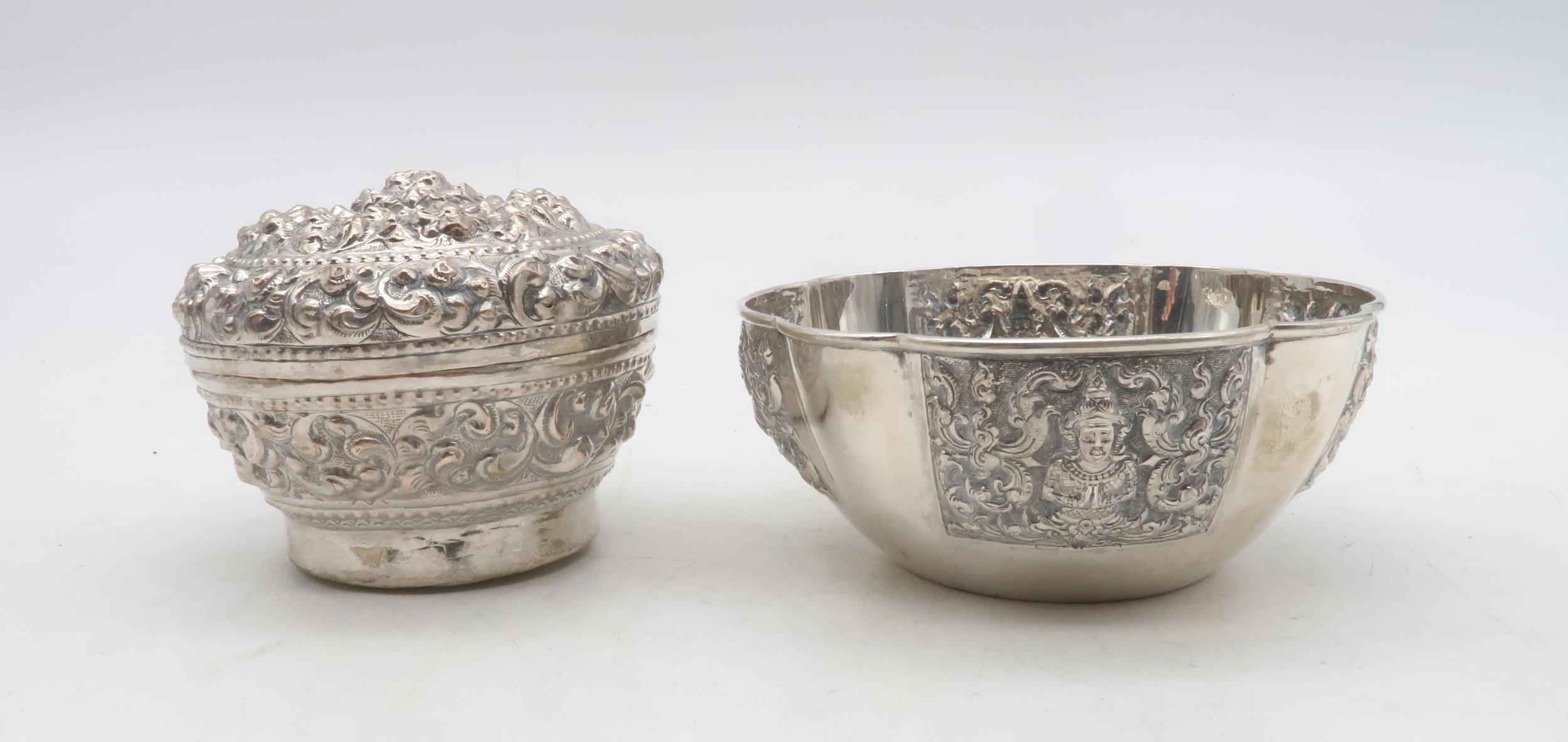 A Thailand Sterling bowl, of lobed form, decorated with repousse panels of deities, and a Persian