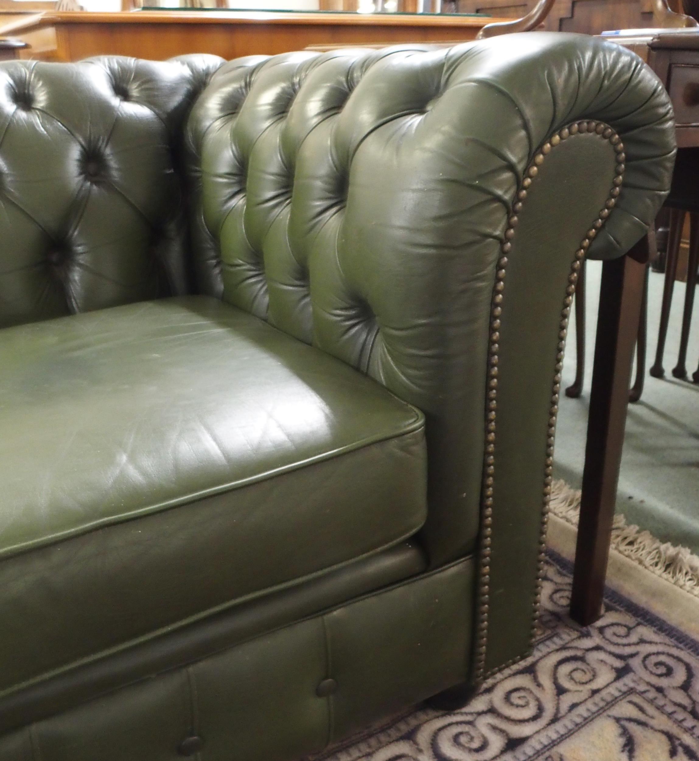 A 20th century green leather upholstered Chesterfield style three seater button back club settee - Image 5 of 5