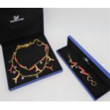 A Swarovski coral themed necklace and bracelet set, with enamelled and gem set coral elements