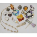 A collection of silver and white metal gem set jewellery to include amber, labradorite, moonstone