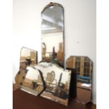 A lot of five assorted 20th century frameless bevelled glass wall mirrors (5) Condition Report: