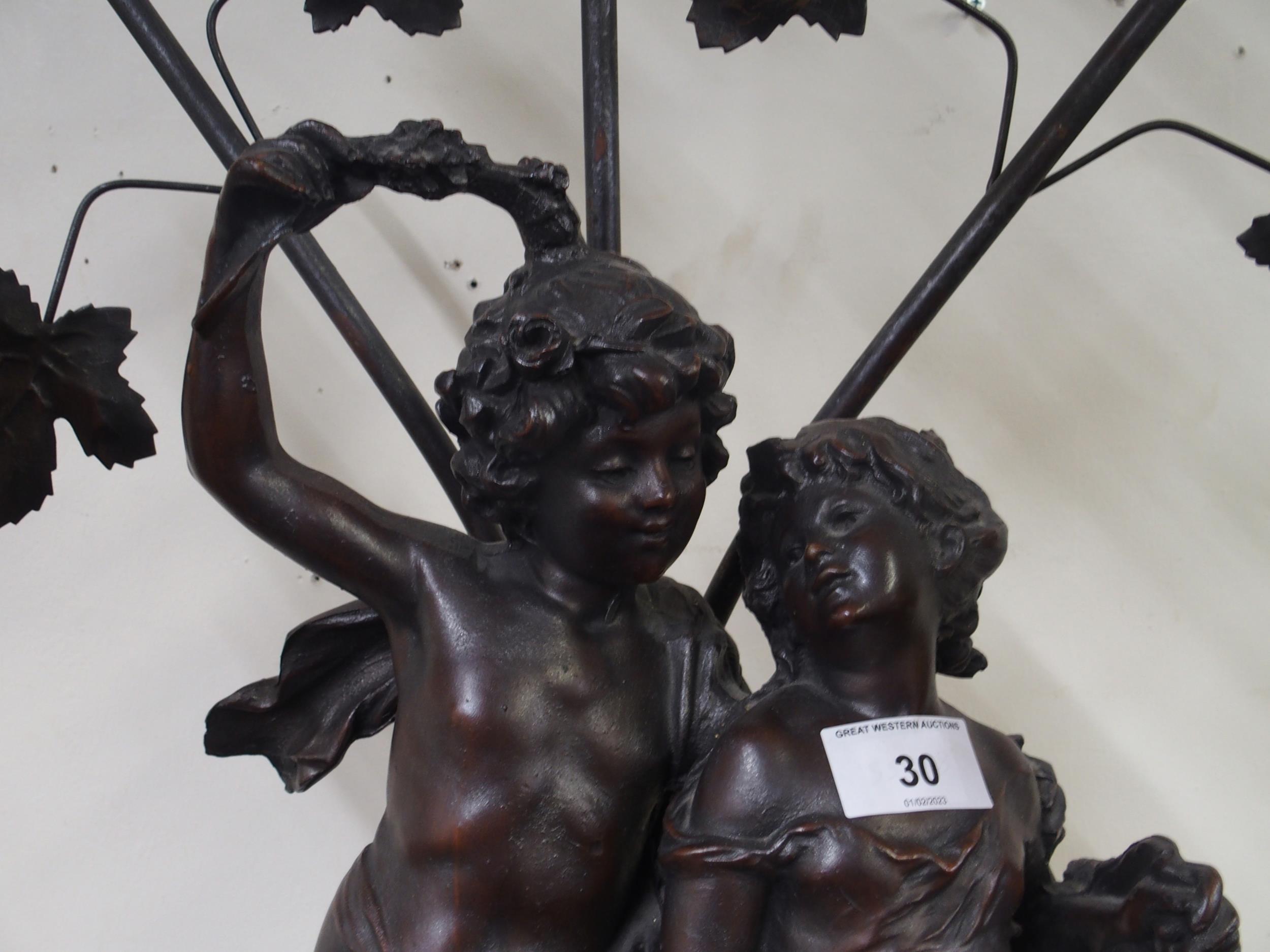 A 20th century spelter figural table lamp with three floral moulded glass shades, 84cm high - Image 2 of 5