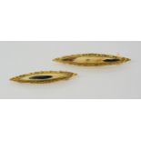 Two gold nugget brooches, the back of the brooch is stamped 14k with many tiny gold nuggets soldered
