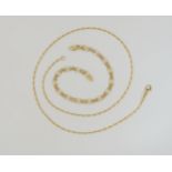 An 18ct gold wheat seed chain, length 47cm, together with an 18ct fancy link bracelet, weight
