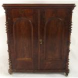 A late Victorian mahogany two door cabinet with panelled doors and sides, 77cm high x 69cm wide x