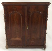 A late Victorian mahogany two door cabinet with panelled doors and sides, 77cm high x 69cm wide x