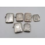 A collection of silver vestas, including an Art Nouveau style example by Ari D Norman, London