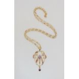 A 9ct gold amethyst Edwardian pendant, on a 9ct belcher chain, length of pendant 5cm, length of