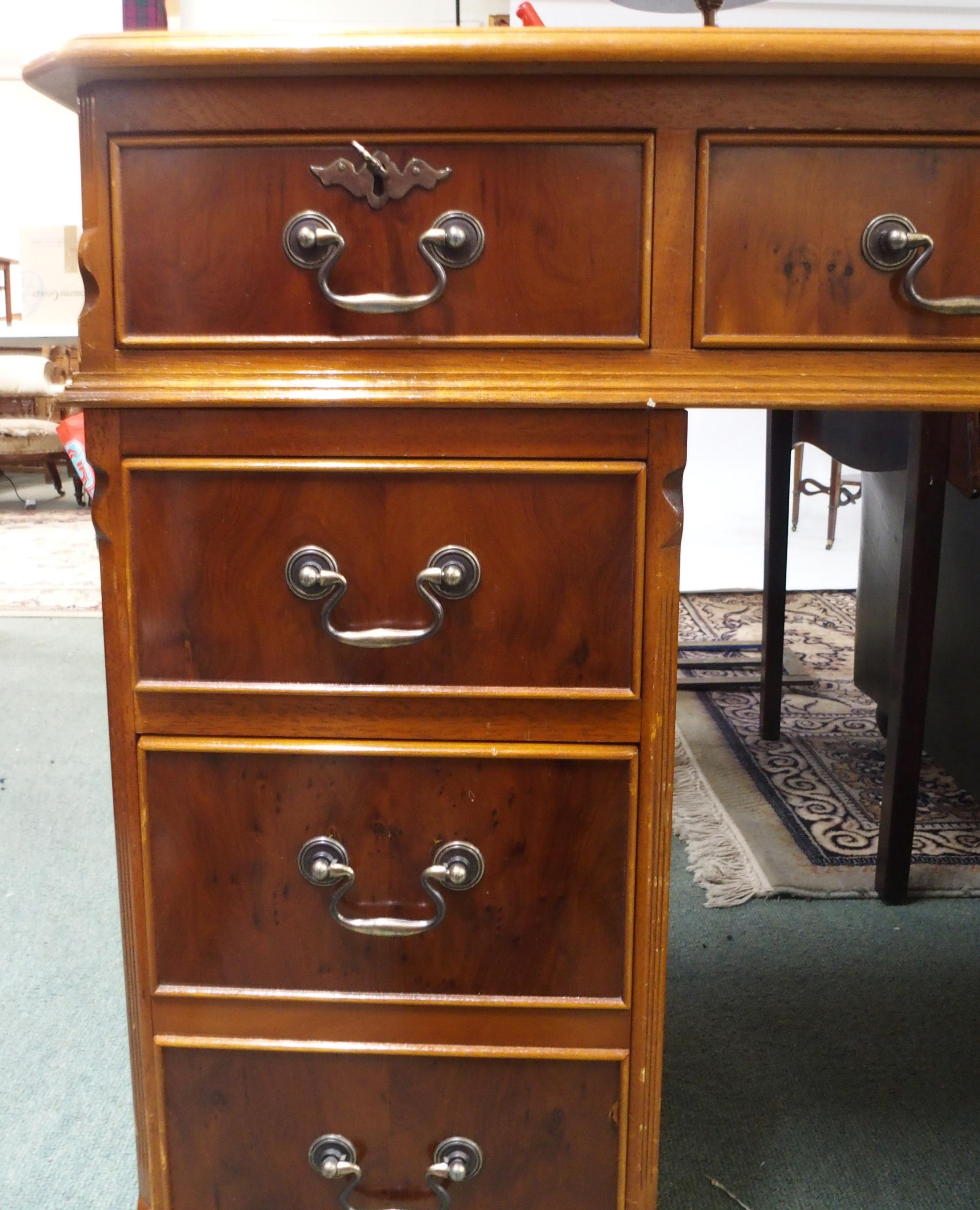 A 20th century mahogany twin pedestal writing desk with green writing skiver over central long - Image 3 of 8