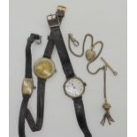 Two silver cased ladies vintage watches and a Nickle cased example, and a white metal fob chain with
