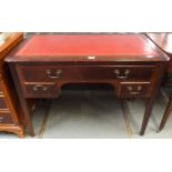A 20th century mahogany writing desk with red skiver top over long drawer over two short drawers
