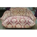 A Victorian walnut framed parlour settee with damask patterned upholstery, 73cm high x 140cm wide