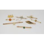 A collection of 9ct and yellow metal brooches to include two pearl and gem set bug brooches and