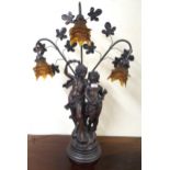 A 20th century spelter figural table lamp with three floral moulded glass shades, 84cm high