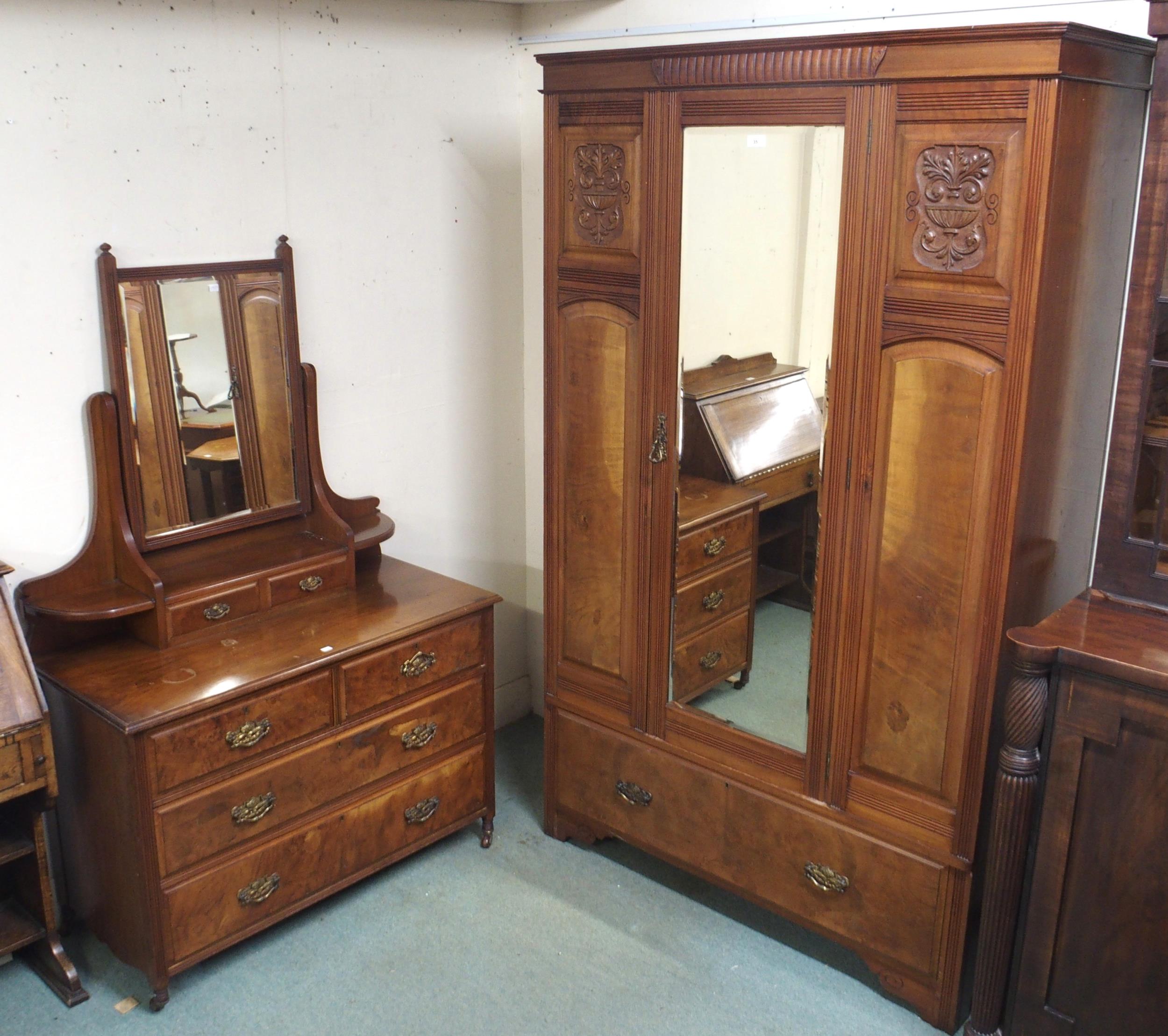 A late Victorian mahogany and walnut veneered two piece bedroom suite comprising single mirror
