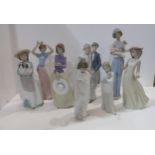 Eight Nao figures including a bride and groom, girl with puppies etc Condition Report:Available upon