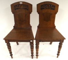 A pair of 19th century hall chairs with carved splats on turned supports, 87cm high x 44cm wide x
