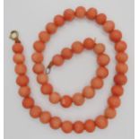 A string of coral beads, each bead approx 12mm x 10mm, weight 97.9gms Condition Report:No