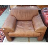 A 20th century brown leather upholstered Walter Knoll armchair, 72cm high x 95cm wide x 85cm deep