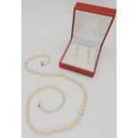 A string of Cintra graduated cultured pearls, largest pearl 7mm, necklace length 26cm long, together