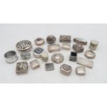 A collection of silver, white metal and EPNS pill boxes, one example with a pierced lid,