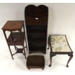 A 20th century oak magazine rack/open bookcase, mahogany bedside table and two footstools (4)