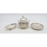 A silver and glass sugar pot, of spherical form, with twin handles and a pierced band to the body,