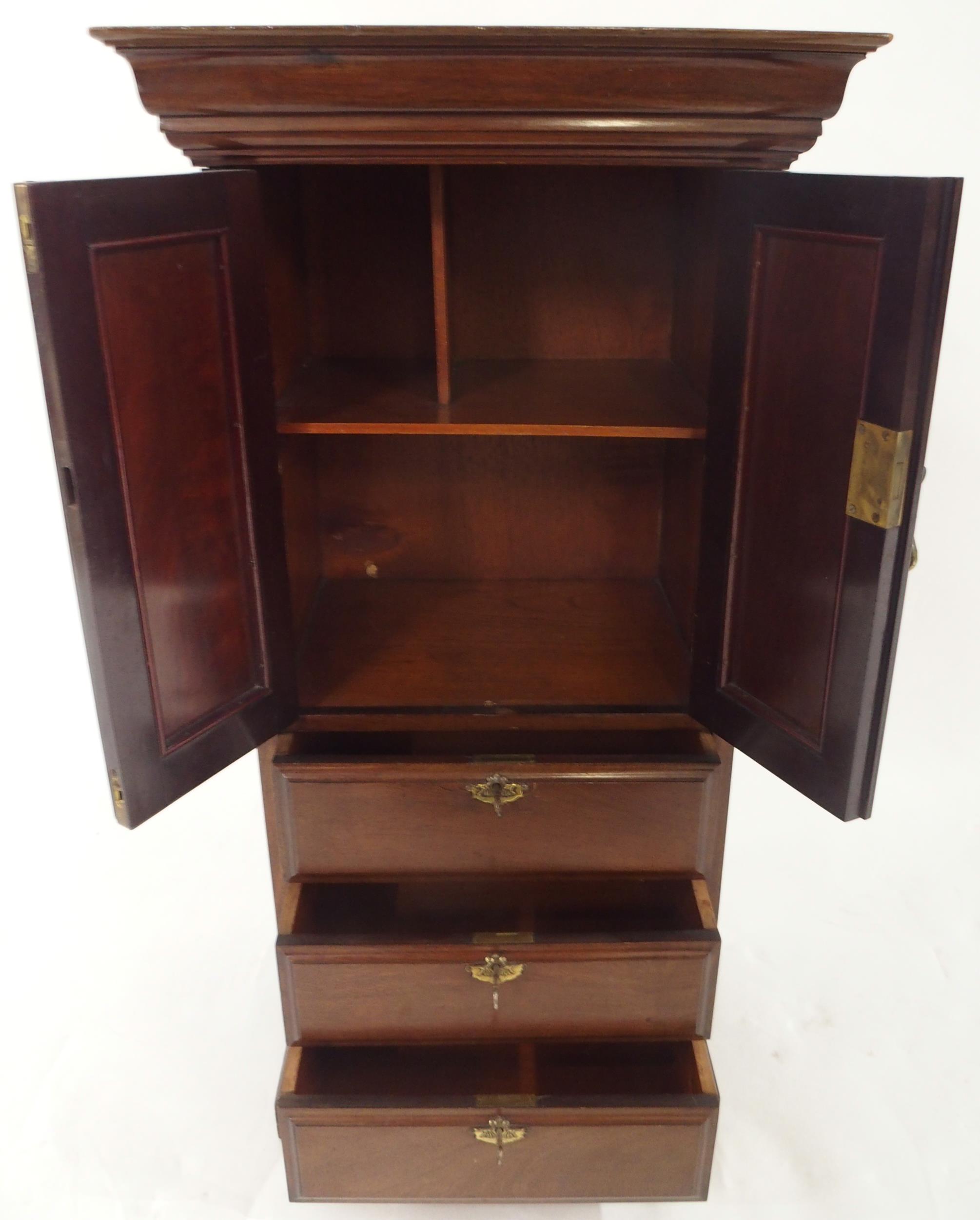 An early 20th century mahogany apprentice style cabinet with moulded cornice over pair of scrolled - Image 3 of 4