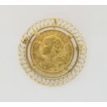 A 1935 Swiss Helvetia 20 Franc coin in a yellow metal brooch mount, weight all together 10.5gms