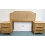 A pair of contemporary beech Ercol three drawer bedside chests and a bergere headboard (3) Condition