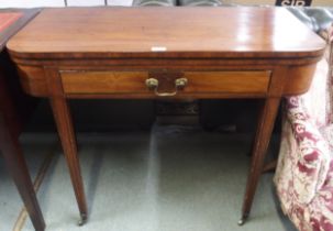 A Victorian mahogany fold over tea table with single drawer on square tapering supports, 75cm high x