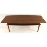 A mid 20th century teak coffee table in the manner of Edvard Kindt Larsen with turned tapering