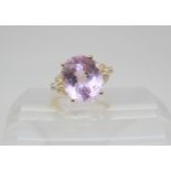 A 9ct gold GemsTV kunzite and zircon ring, designed by Thomas Rae, size O, weight 5.5gms Condition