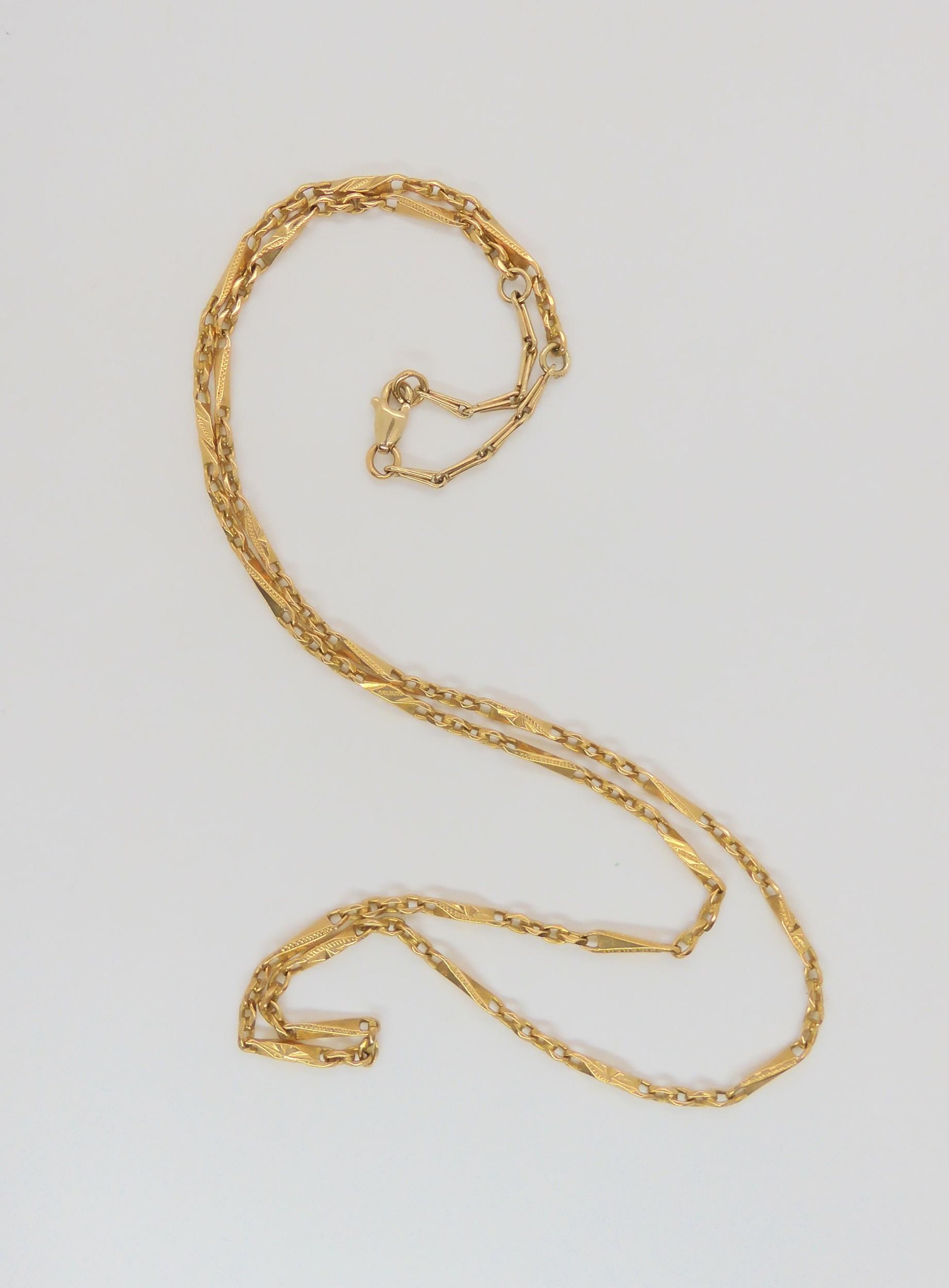 A bright yellow fancy baton link chain, with a 9ct gold extension and clasp, length 58cm, weight