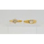 A 14k gold diamond cluster ring, size N,Ê together with a bright yellow metal clear gem set ring,