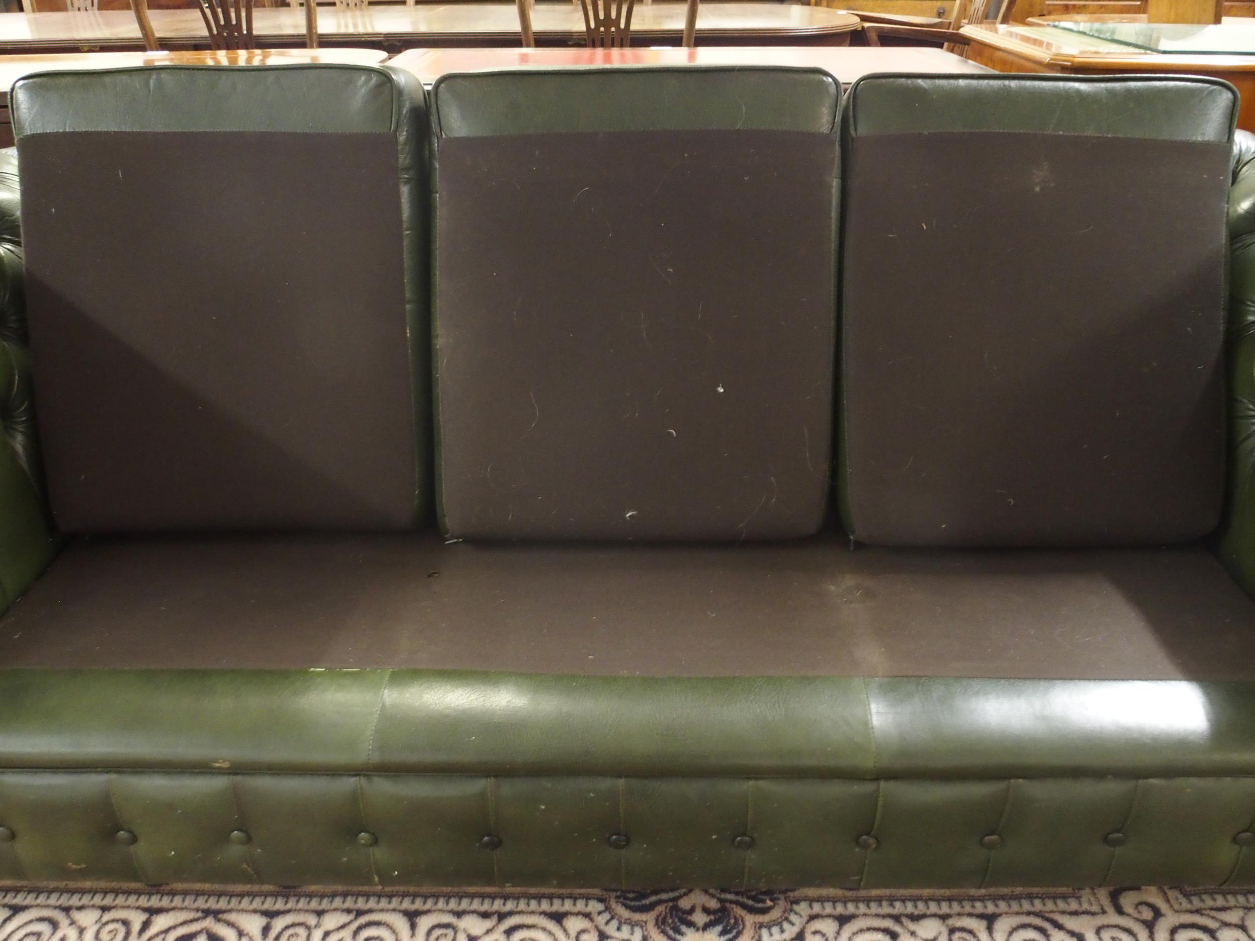 A 20th century green leather upholstered Chesterfield style three seater button back club settee - Image 4 of 5