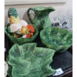 Italian green glazed leaf pattern dishes and bowls, together with a model of a cockerel Condition