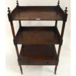 A Victorian mahogany three tier what-not with three open galleried shelves over single drawer with