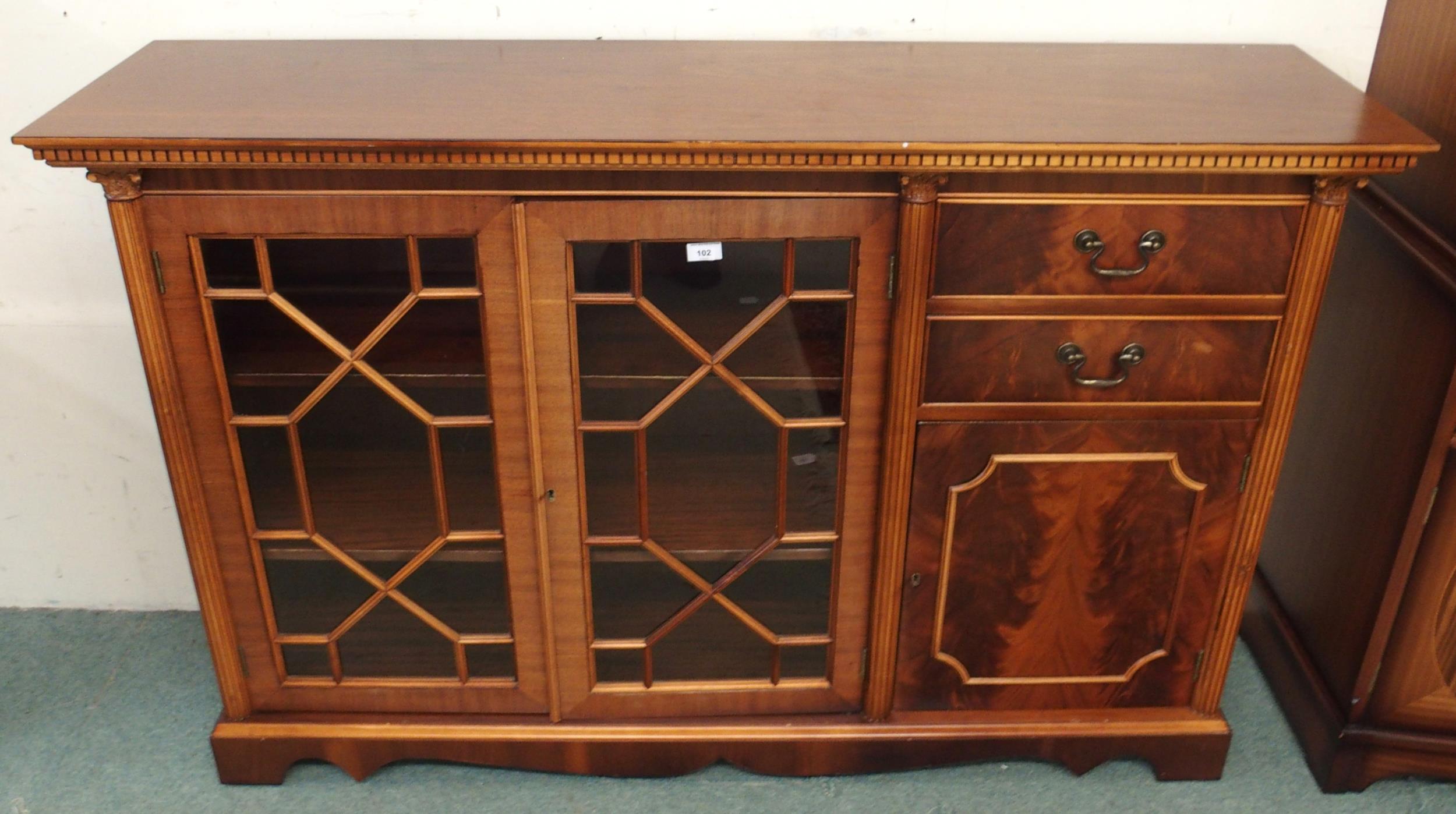 A 20th century mahogany reproduction astragal glazed bookcase, 96cm high x 148cm wide x 38cm deep