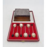 A cased set of silver coffee spoons, by Turner & Simpson, Birmingham 1972, and a silver topped