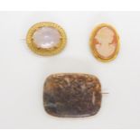 three vintage yellow metal brooches, a specimen moss agate, a pale amethyst in a leaf pattern