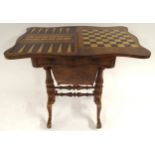 A Victorian walnut and satinwood inlaid fold over games table with serpentine fold over top