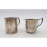 A silver mug, of cylindrical form, the body monogrammed, Birmingham marks, and another silver mug,