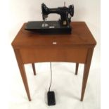 A Singer 221 Featherweight sewing machine serial number EG642200 (lacking case, leads etc) and a