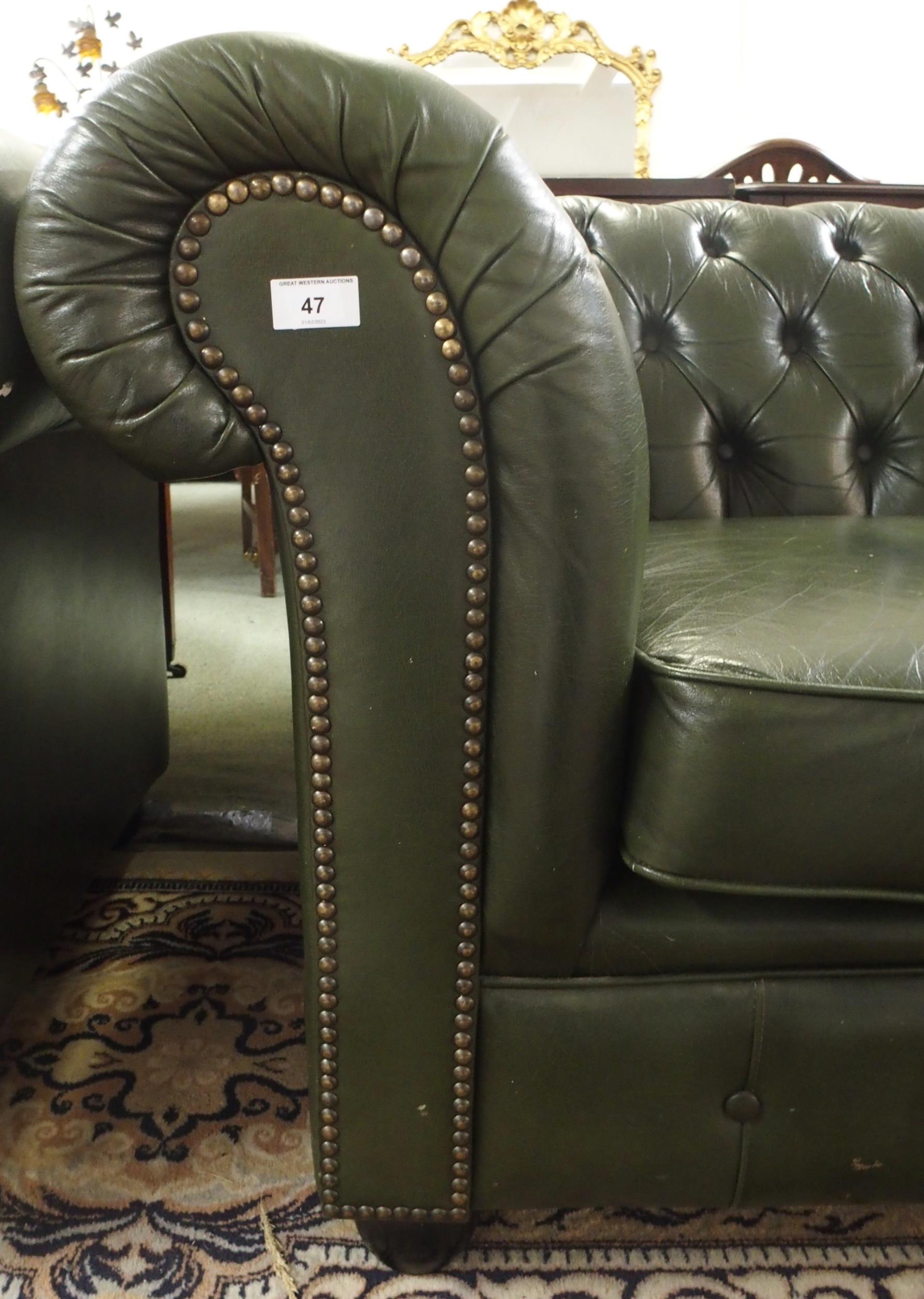 A 20th century green leather upholstered Chesterfield style three seater button back club settee - Image 3 of 5