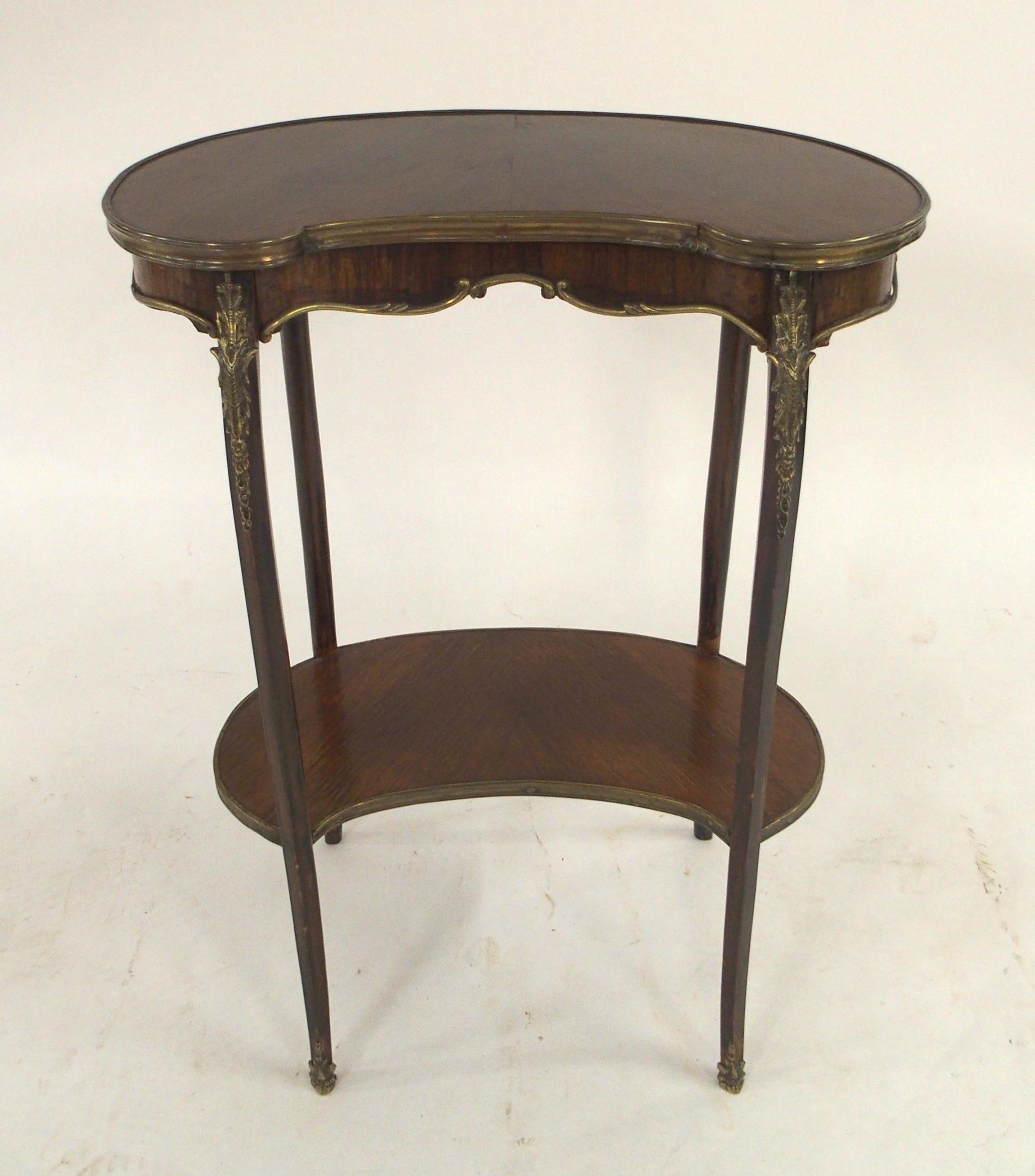 A LOUIS XV STYLE KINGWOOD TWO TIER KIDNEY SHAPED OCCASIONAL TABLE with gilt brass ormolu mounts to