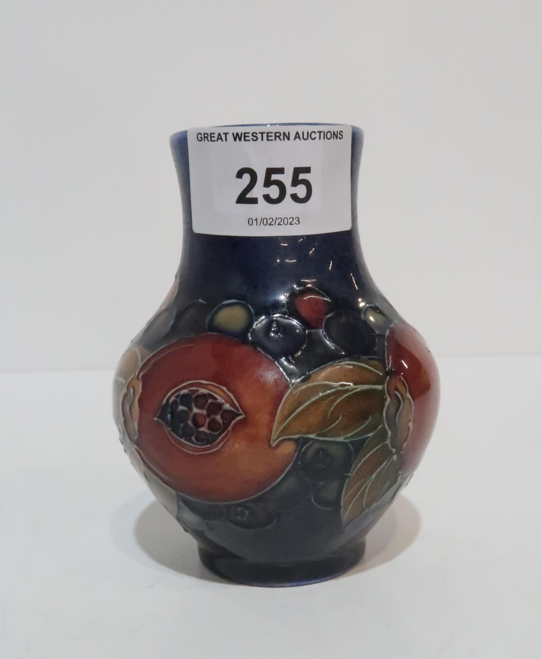 A Moorcroft Pomegranate vase, 10cm high Condition Report:Available upon request