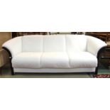A contemporary Stressless for Ekornes "Manhattan" three seater sofa upholstered in white leather